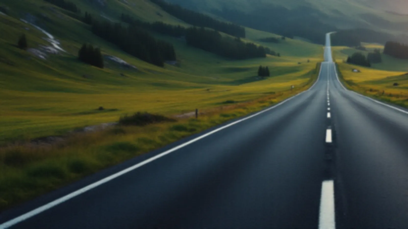 An empty mountain road climbing through green alpine meadows at sunrise, the GearboxNote view of short-term loans online, $100 – $5,000